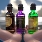 Разум и тело - Hand holding essential oils bottles ca