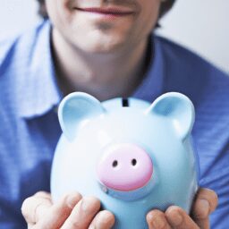 Бизнес и финансы - Person holding piggy bank portrait