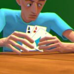 Досуг - Person playing cards with intense focu