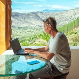 Бизнес и финансы - Person working remotely on laptop ov