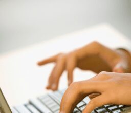 Бизнес и финансы - Hands typing on laptop keyboard portra