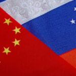 Бизнес и финансы - Russian and chinese flags intertwining